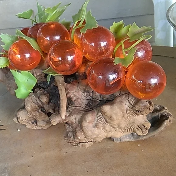 Vintage 1970s large orange lucien grapes on driftwood